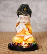 eCraftIndia Praying Orange Monk Buddha with Wooden Base, Fragranced Petals and Tealight