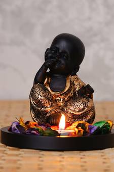 eCraftIndia Decorative Smiling Golden Monk Buddha with Wooden Base, Fragranced Petals and Tealight
