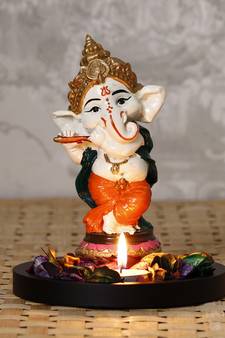 eCraftIndia Colorful Lord Ganesha Dancing Avatar Decorative Showpiece with Wooden Base, Fragranced Petals and Tealight