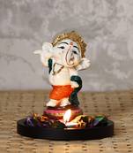 eCraftIndia Colorful Lord Ganesha Dancing Avatar Decorative Showpiece with Wooden Base, Fragranced Petals and Tealight