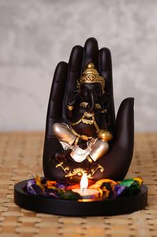 eCraftIndia Golden Handcrafted Palm Ganesha Decorative Showpiece with Wooden Base, Fragranced Petals and Tealight