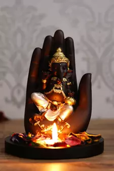 eCraftIndia Golden Handcrafted Palm Ganesha Decorative Showpiece with Wooden Base, Fragranced Petals and Tealight