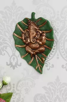eCraftIndia Brown Lord Ganesha on Green Leaf Wall Hanging
