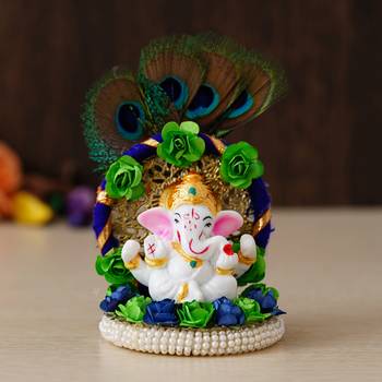 eCraftIndia Lord Ganesha Idol on Decorative Handcrafted Floral Plate with Peocock Feather for Home and Car 1