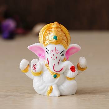 white lord ganesha idol with golden mukut 1