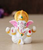white lord ganesha idol with golden mukut