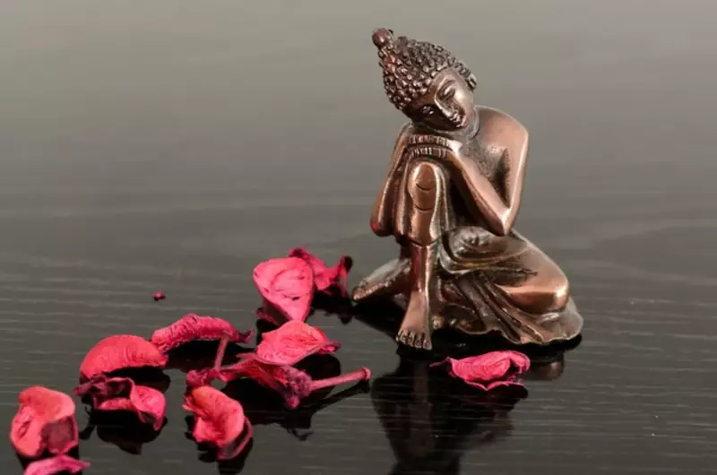 Metal Resting Buddha on Knee