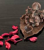 Metal Lord Ganesha with Diya on Leaf
