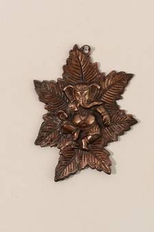 Metal wall hanging of Lord Ganesha on Maple Leaf