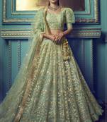 Graceful Green Sequins and Dori embroidered and ruffle worked net fabric lehenga choli for bride