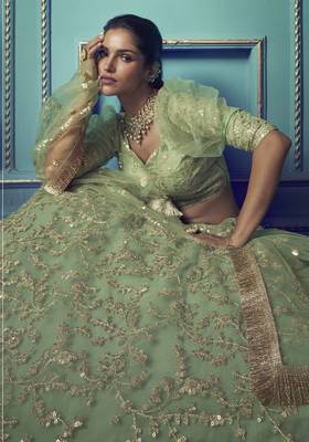 Graceful Green Sequins and Dori embroidered and ruffle worked net fabric lehenga choli for bride 3