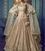 Mesmerizing Beige Sequins embroidered and Ruffle work net fabric bridal lehenga