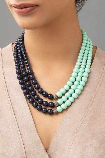 Bluish-black brass necklace sporting Swarovski shell pearls