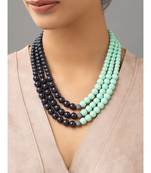 Bluish-black brass necklace sporting Swarovski shell pearls