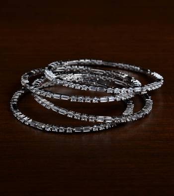 Rhodium finish two pairs of diamond bangles 1