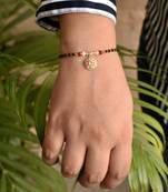 Red and Peach Embellished Mangalsutra bracelet. 