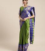 Green woven silk blend saree with blouse