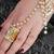 Golden and white pearl hand harness