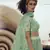 Green sequins embroidered net semi stitched lehenga