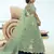 Green sequins embroidered net semi stitched lehenga