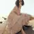Peach sequins embroidered net semi stitched lehenga
