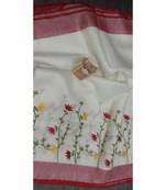 white Handcrafted Linen Saree with embroidery work on the saree