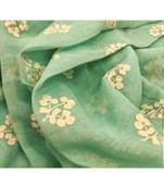 green Handcrafted Linen Saree with embroidery work on the saree