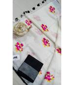 white Handcrafted Linen Saree with embroidery work on the saree