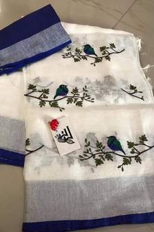 white Handcrafted Linen Saree with embroidery work on the saree
