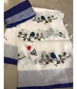 white Handcrafted Linen Saree with embroidery work on the saree