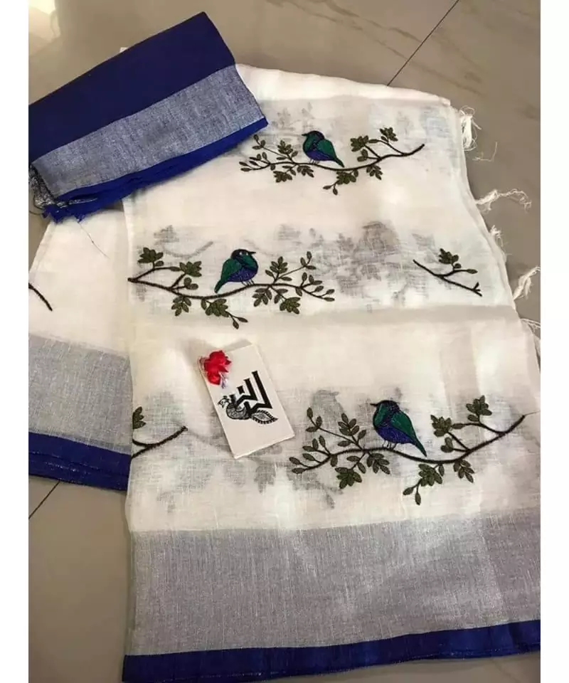 white Handcrafted Linen Saree with embroidery work on the saree