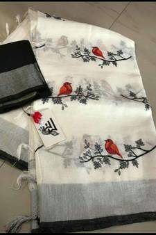 white Handcrafted Linen Saree with embroidery work on the saree