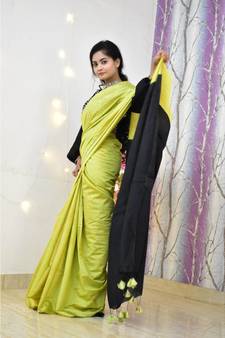 Handwoven cotton silk saree with contrast pallu and contrast blouse piece with tassels in the pallu