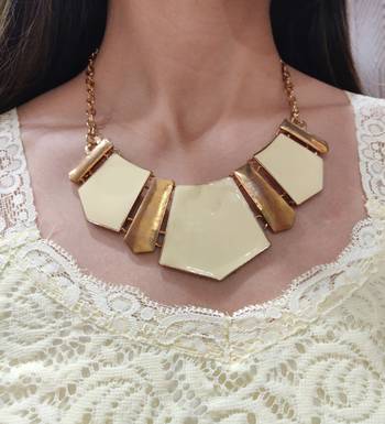 Off White Necklace with Rose Gold Polish 1
