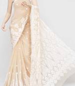 Beige embroidered georgette saree with blouse