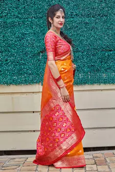 Orange woven banarasi silk saree with blouse