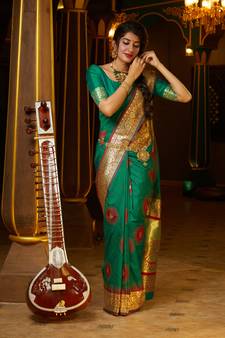 Green woven banarasi saree with blouse