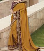 Mustard embroidered satin saree with blouse