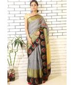 grey linnen saree with hand embroidered applique jhumkis on shoulder and brocade border and brocade blouse piece
