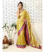 gold linnen tissue saree with applique work on pallu and brocade border and brocade blouse piece
