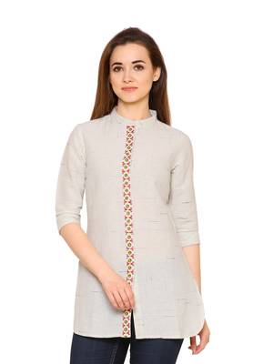 Cream embroidered cotton tunics 1