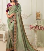 Green embroidered silk blend saree with blouse