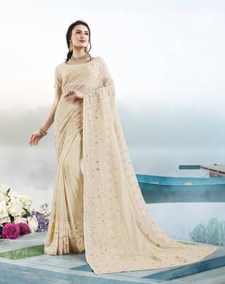 Cream embroidered faux georgette saree with blouse 1