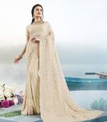 Cream embroidered faux georgette saree with blouse
