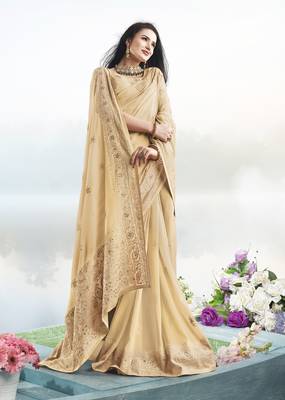 Cream embroidered faux georgette saree with blouse 2