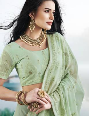 Light green embroidered faux georgette saree with blouse 3