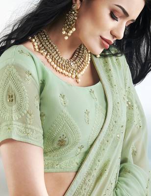 Light green embroidered faux georgette saree with blouse 4