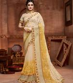 Cream embroidered net saree with blouse