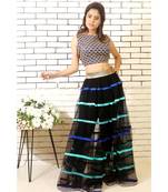 black net skirt with silk hand made ribbons and embroidered blouse with black slacks