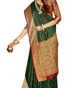 Dark green woven silk saree with blouse